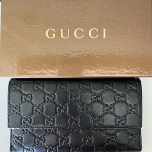 Gucci black leather monogram trifold long wallet